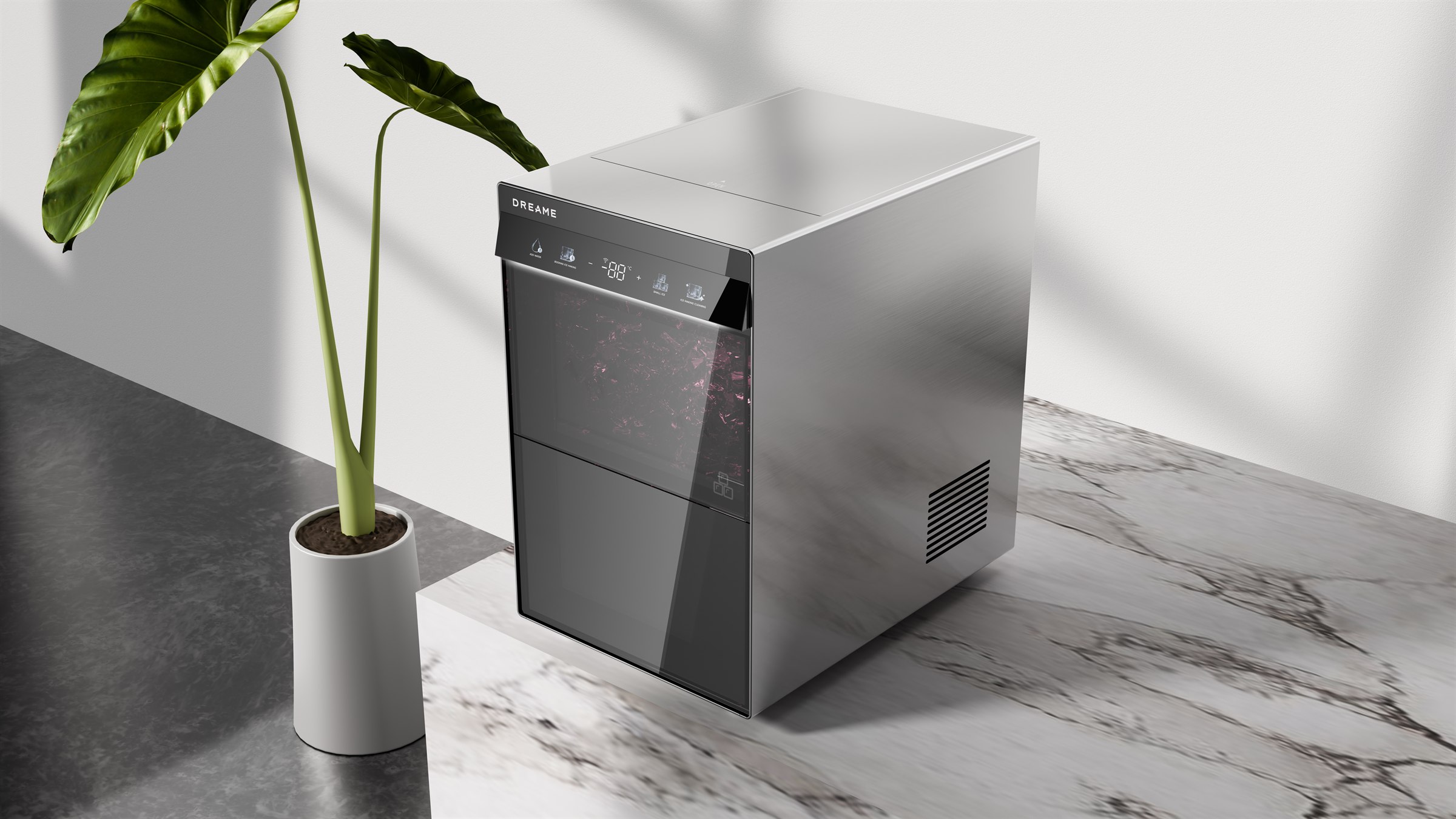 Countertop ice maker in a dark marble kitchen scene